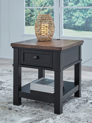 which pairs a warm satin black base with a contrasting butcher block veneer top. A spacious storage drawer and