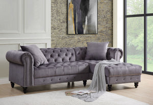 Create a chic living room with the Adnelis sectional sofa. It is beautifully upholstered in lustrous velvet. It is designed with spectacular attention to fine details such as button tufting and nail-head trim accents. The rolled armrests add a regal touch