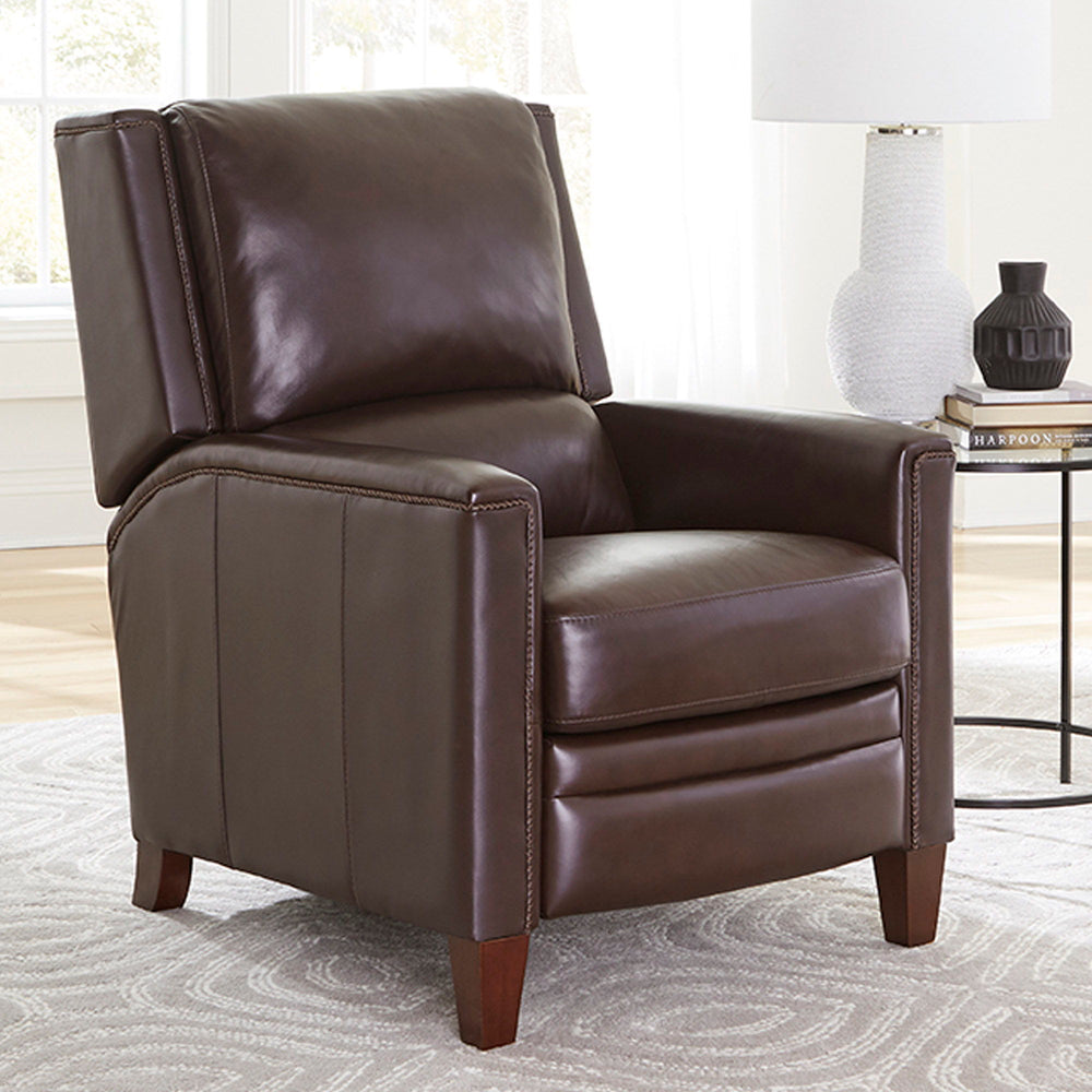 The Connor recliner boasts an effortless power recline for seamless relaxation. Upholstered in the finest soft leather with a custom match, it exudes sophistication. The decorative twisted rope stitching detail adds a touch of elegance, while the high leg