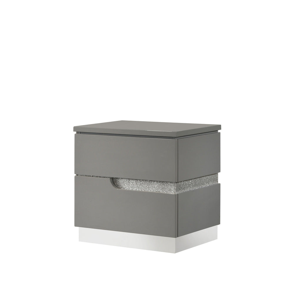 The Paradox Two Drawer Nightstand in Gray brings a blend of contemporary appeal and functional elegance to your bedroom. Featuring a gleaming Gray gloss laminate finish, this nightstand offers a sleek and modern look with the added benefits of scratch and