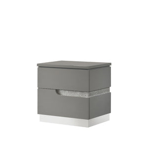The Paradox Two Drawer Nightstand in Gray brings a blend of contemporary appeal and functional elegance to your bedroom. Featuring a gleaming Gray gloss laminate finish, this nightstand offers a sleek and modern look with the added benefits of scratch and
