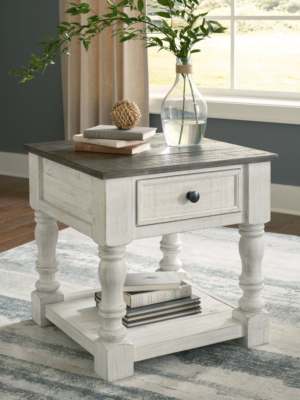 What a fresh interpretation of country classic style. Inspired by American farmhouse craftsmanship, but with an elevated sensibility, this square end table blends distinctive details such as turned post accents and raised drawer fronts for a substantial l