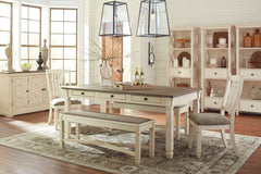Unique two-tone finish with a combination of Oak and Acacia substrates combining a trendy textured antique white color with table and server tops finished in a textural weathered oak finish. Rectangular dining table features six convenient drawers for sto