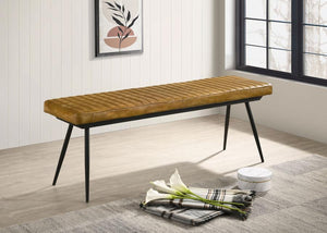  this dining bench is a bold yet versatile seating option. Upholstered in hand-dyed genuine goat leather