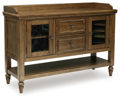 Traditional style doesnâ€™t have to be stuffy. It can feel warm, inviting and beautifully in the moment. Case in point: this dining server. It-'s ready to stand in as an entertainment center, entryway storage or a console table, with a profiled top and gl