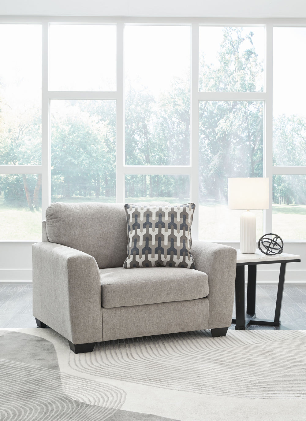 Need a simple style refresh? Liven up your space with this oversized chair. Its sleek design invites you to sink into the generous cushions. Plush, textured upholstery creates a captivating look that works for aesthetics ranging from classic to contempora