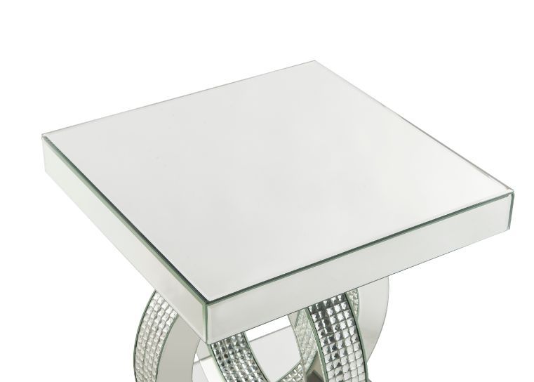 Make a striking statement in your home with this Ornat End Table. Featuring mirrored frame with faux diamond inlay, it creates a bold, yet elegant textured look. Classic pedestal base gives it an elegant support, with spectacular faux diamonds inlay addin
