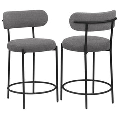 Your kitchen island or counter table gets an instant upgrade with this set of two modern barstools. The pair features contemporary boucle upholstery in a neutral hue over foam cushions for comfort. Metal framing features a black finish and provides excell