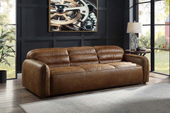 The allure of the Rafer sofa lies in details like piped seams, full foam seat cushions, and Cocoa top grain leather upholstery. These are balanced with an inviting profile, creating a piece that fits perfectly in a casual apartment as it does a formal liv