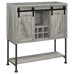 Perfect for a cottage or lakeside getaway, this bar cabinet features a light grey driftwood finish that is charming and cheerful. Place this bar cabinet in a rustic farmhouse home, as it offers country charm with two sliding barn doors that offer ample st