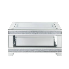Add sparkle into your life with this striking Noralie mirrored and faux diamonds coffee table. The clear tempered glass top is as beautiful as it is sturdy. The large surface area gives you room for displaying your reading materials or other collectibles.
