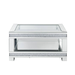 Add sparkle into your life with this striking Noralie mirrored and faux diamonds coffee table. The clear tempered glass top is as beautiful as it is sturdy. The large surface area gives you room for displaying your reading materials or other collectibles.
