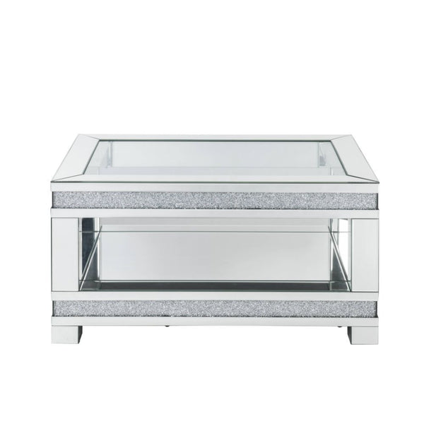 Add sparkle into your life with this striking Noralie mirrored and faux diamonds coffee table. The clear tempered glass top is as beautiful as it is sturdy. The large surface area gives you room for displaying your reading materials or other collectibles.