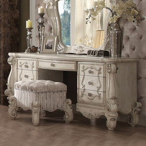 The Versailles vanity desk is the perfect accent to create the style of royalty your bedroom has been needing. This vanity desk crafted in wood with bone white finish was inspired by old European design with brown copper metal hardware and intricate wood 