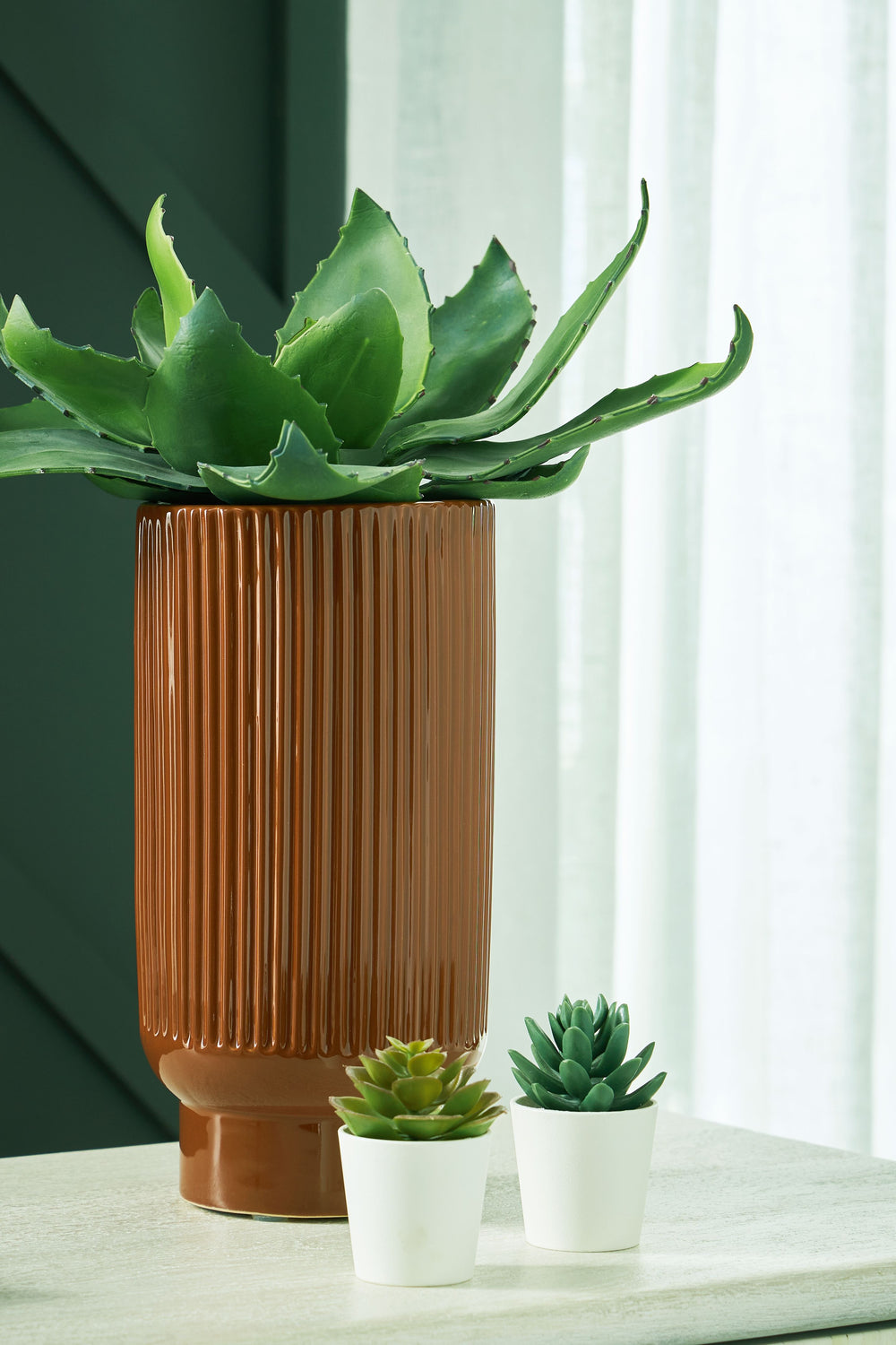 This ceramic vase makes a relaxed style statement. Its casual design and earthy burnt umber glaze complement your laid-back sensibilities. Delightfully simple and simply delightful, this vase subtly wows on its own or when filled with your favorite flower
