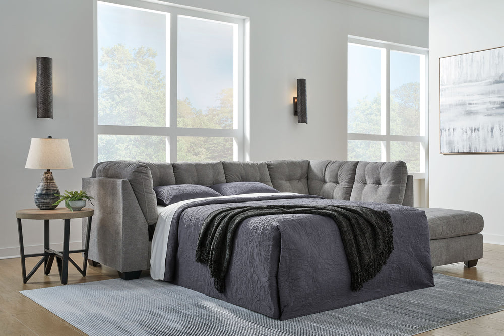 This sleeper sectional with chaise takes a homey approach to high style. Its gray coloration has classic versatility, while a contemporary silhouette and stitched details keep the look totally on trend. And you can count on comfortâ€”the included full mat
