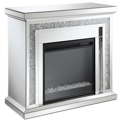 Glimmering, crushed crystals lend a luxurious accent to this glam fireplace. Covered by mirror tiles, trims and beveled edges, this freestanding electric fireplace offers a relaxing glow to a space. For a bit of warmth, turn on the heater element for a mo