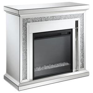 Glimmering, crushed crystals lend a luxurious accent to this glam fireplace. Covered by mirror tiles, trims and beveled edges, this freestanding electric fireplace offers a relaxing glow to a space. For a bit of warmth, turn on the heater element for a mo