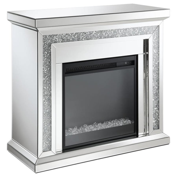 Glimmering, crushed crystals lend a luxurious accent to this glam fireplace. Covered by mirror tiles, trims and beveled edges, this freestanding electric fireplace offers a relaxing glow to a space. For a bit of warmth, turn on the heater element for a mo