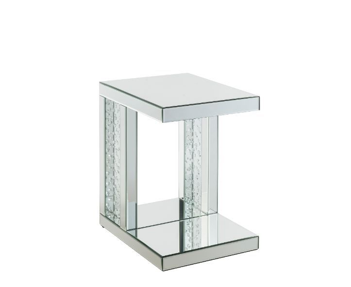 Go full glam with this Nysa Accent Table. The clear mirrored table top and glistening faux crystals inlay will reflect light and make any room appear larger. It provides a spacious table top ample enough for displaying various decor items while the unique