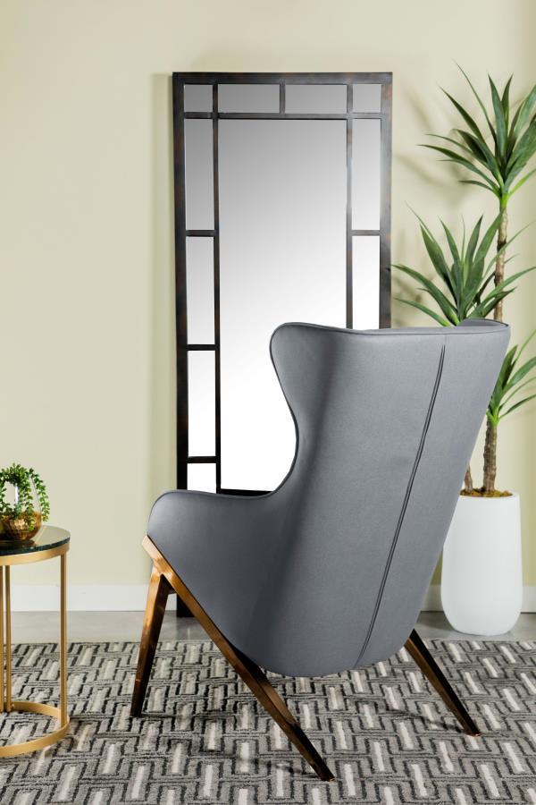 A glorious accent chair makes a magnificent display in your living space. The beautiful wingback design adds a hint of drama where you need it the most. Smooth and sleek leatherette material makes it a comfortable seating option. Sloped armrests add to it