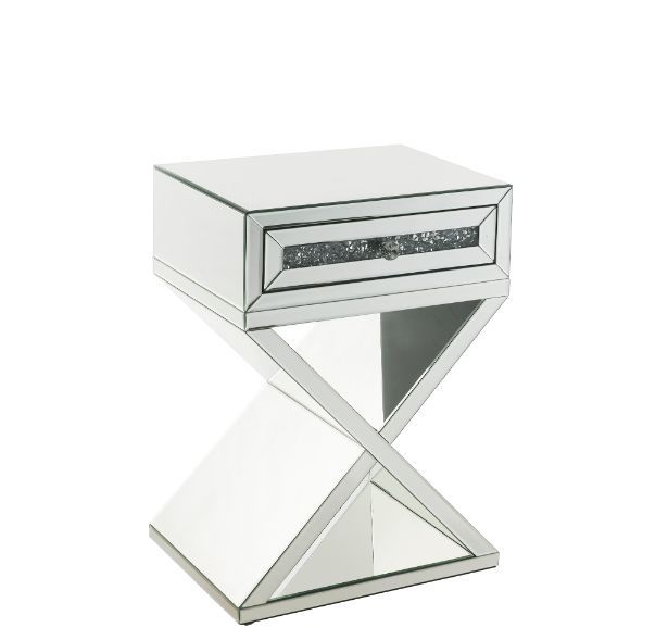 Bring life into your home with this dazzling Noralie Accent Table. With a glamorous mirror finish and unique X-shaped base to impress all of your guests, the accent table boasts a faux diamonds inlay that reflect a rainbow of colors throughout the room. T
