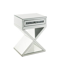 Bring life into your home with this dazzling Noralie Accent Table. With a glamorous mirror finish and unique X-shaped base to impress all of your guests, the accent table boasts a faux diamonds inlay that reflect a rainbow of colors throughout the room. T