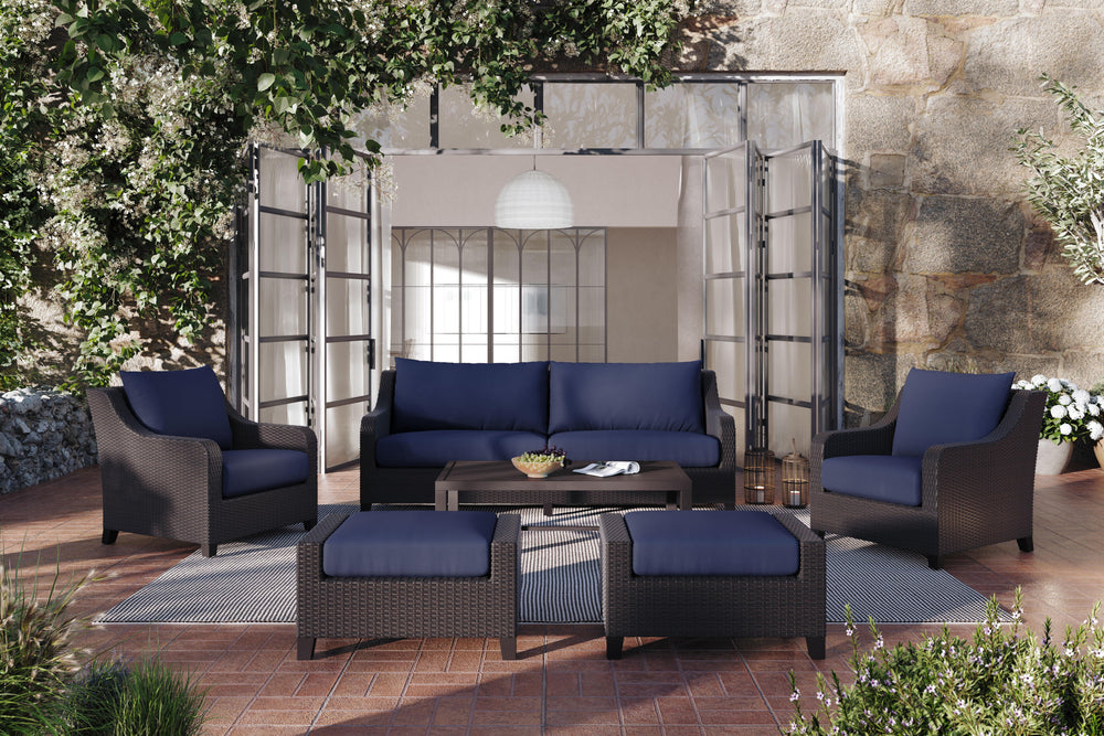 Enhance your outdoor living space with the Skye Outdoor Patio 6 Piece Conversation Set in rich Navy Blue. This set includes a three-seater sofa, two club chairs, two matching ottomans, and a coffee table, offering ample seating and comfort for your guests