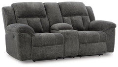 With its large-scale design, this extra-spacious reclining loveseat with console is a masterclass in accessible style. Plush, ultra-soft upholstery keeps everyone cozy as you lounge with family or guests. In a neutral hue, it seamlessly suits different ae