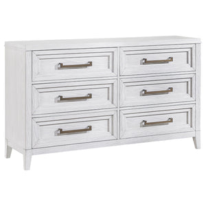 Light distressing offers depth and dimensionality to a modern six-drawer dresser. Perfect for clothing and other accessories, it features a double profile with three drawers on each side. A white finish allows wood grain details to show through, creating 