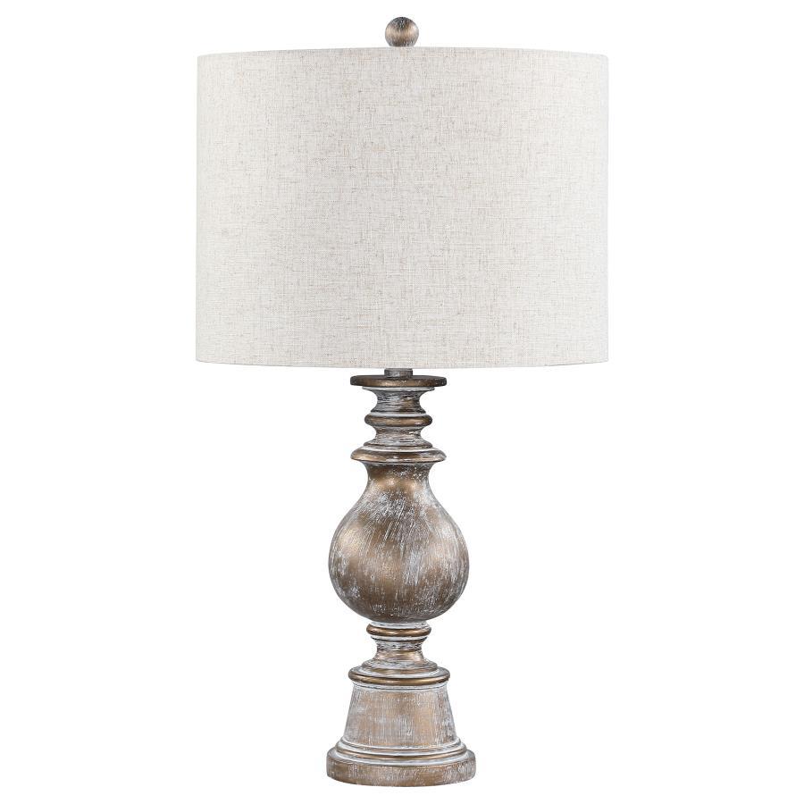 Dress up end tables and consoles with this elegant, contemporary table lamp. Designed with a contoured poly frame with intricate details, this sophisticated table lamp lends itself to transitional interiors easily. Enhanced by the weathered appearance of 