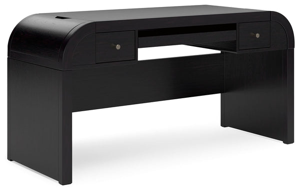 Inspired by art deco design, this softly shaped home office desk makes a lasting impression in a simply stunning way. Its magnificent curved silhouette is enhanced by a rich layered black finish on the textured wood grain surface. Complete with ample stor