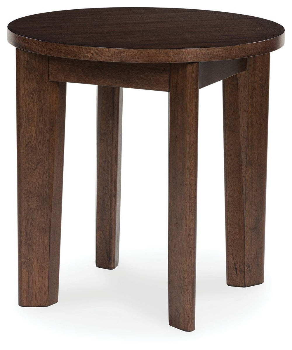 It-'s hard to say what-'s most striking about this round end table. Is it the rich warm brown finish or the thick tapered legs? Either way, the table-'s clean, contemporary aesthetic is perfect for your casual lifestyle. It would look perfect right next t