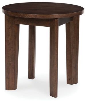 It-'s hard to say what-'s most striking about this round end table. Is it the rich warm brown finish or the thick tapered legs? Either way, the table-'s clean, contemporary aesthetic is perfect for your casual lifestyle. It would look perfect right next t
