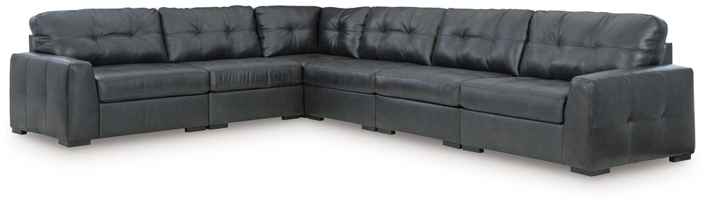 Discover lasting luxury with this sectional. You-'ll experience the perfect blend of comfort and stylish design with its combination of leather and faux leather. Featuring tufted detailing and low-profile legs, this must-have set ensures both coziness and
