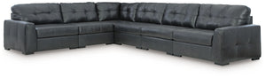 Discover lasting luxury with this sectional. You-'ll experience the perfect blend of comfort and stylish design with its combination of leather and faux leather. Featuring tufted detailing and low-profile legs, this must-have set ensures both coziness and