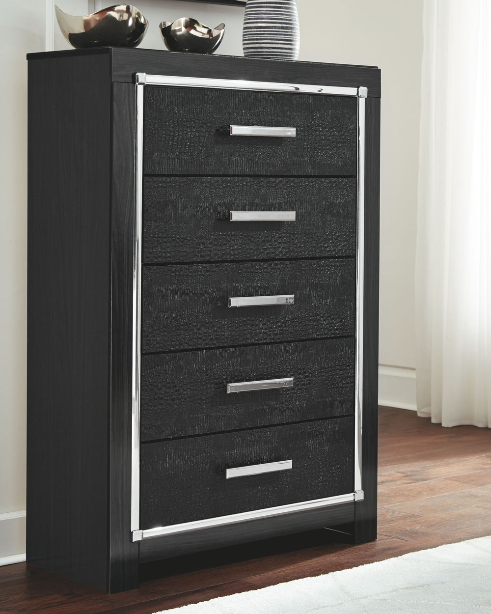 Rest easy. The luxurious look youâ€™ve been dreaming of is yours for the taking, at a price sure to put you at ease. This striking chest of drawersâ€™ deep, dark finish, faceted chrome-tone accents and faux alligator panels exude Hollywood-chic style to t