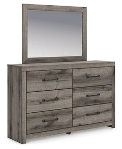 Combining a casual aesthetic with functional flair, this dresser with mirror suits styles from rustic to industrial. Its smooth-gliding drawers store everyday essentials with ease, from clothes to bed linens. Elongated drawer pulls in a dark hue polish of