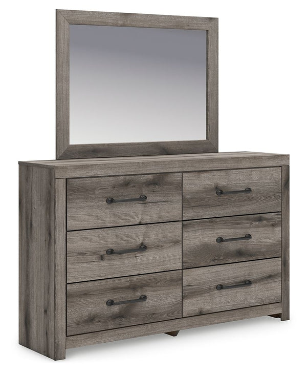 Combining a casual aesthetic with functional flair, this dresser with mirror suits styles from rustic to industrial. Its smooth-gliding drawers store everyday essentials with ease, from clothes to bed linens. Elongated drawer pulls in a dark hue polish of
