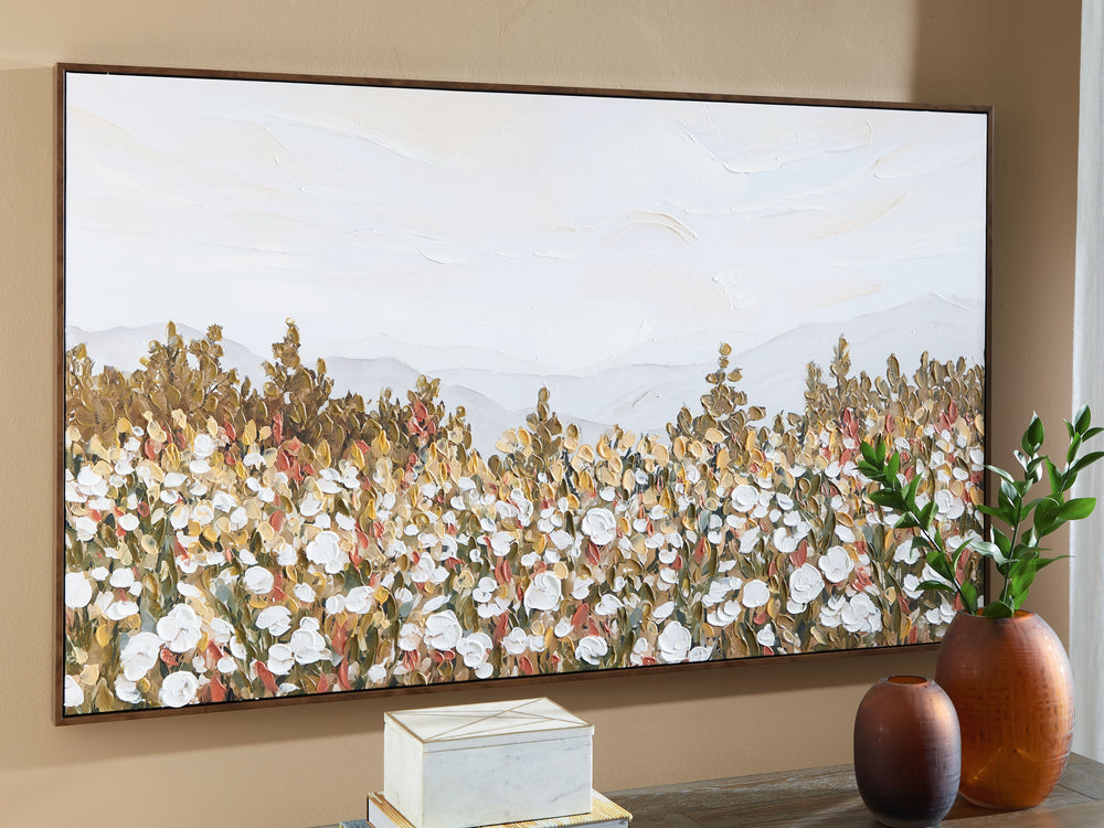 This wall art offers a beautiful contrast between a field of white flowers and the wide-open sky. A serene interpretation of the beauty of nature, its muted tones pair well with a variety of color palettes. Hand-painted embellishments complete the piece.<