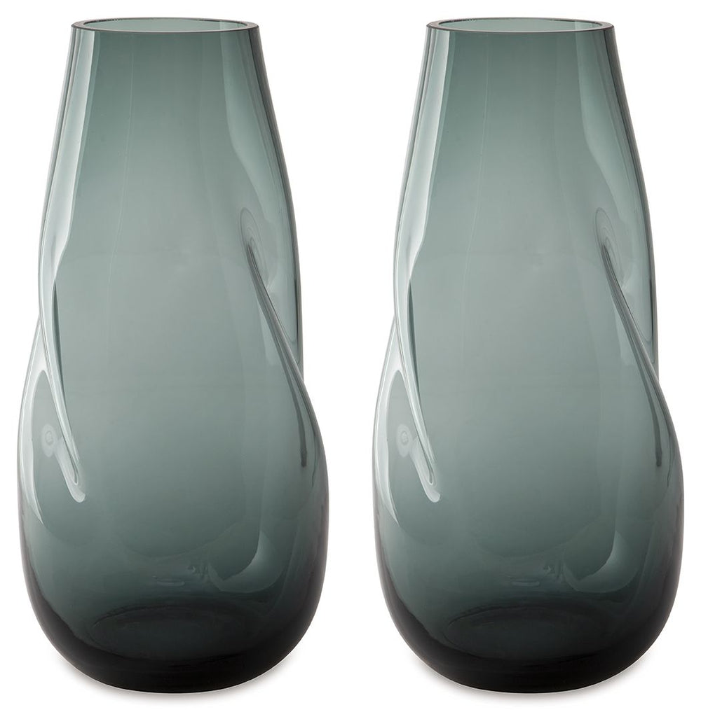 Sleek. Contemporary. Chic. This vase has an organic sense of movement, recalling seaside aesthetics with its teal glass. A stunning solo accent, it also acts as a beautiful vessel for florals and other decorative fillers. And the vase is safe for outdoor 