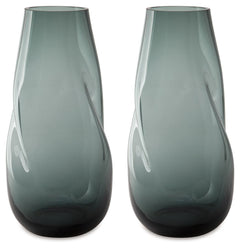 Sleek. Contemporary. Chic. This vase has an organic sense of movement, recalling seaside aesthetics with its teal glass. A stunning solo accent, it also acts as a beautiful vessel for florals and other decorative fillers. And the vase is safe for outdoor 