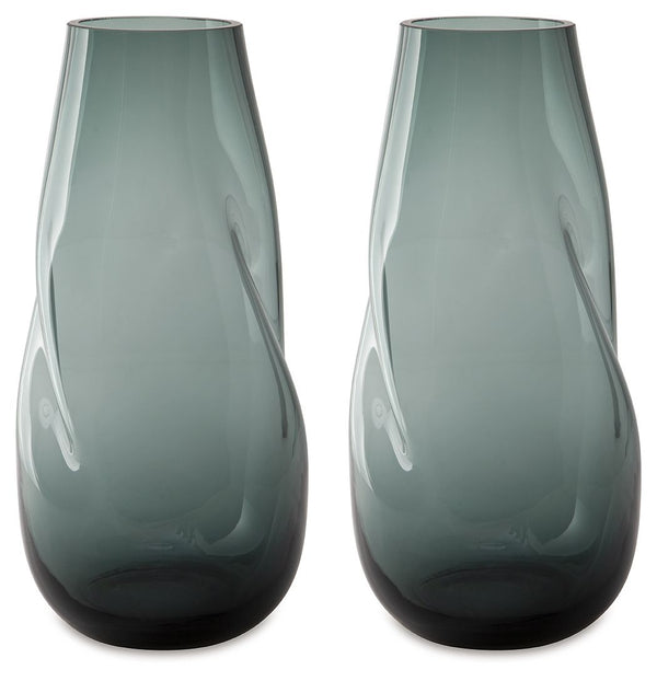 Sleek. Contemporary. Chic. This vase has an organic sense of movement, recalling seaside aesthetics with its teal glass. A stunning solo accent, it also acts as a beautiful vessel for florals and other decorative fillers. And the vase is safe for outdoor 
