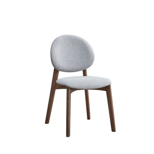 Discover the elegance of the Hadasa dining collection. With its sleek wooden table and matching chairs, this set exudes contemporary charm. The curved design of the table legs and the soft upholstery of the chairs offer both style and comfort. Perfect for