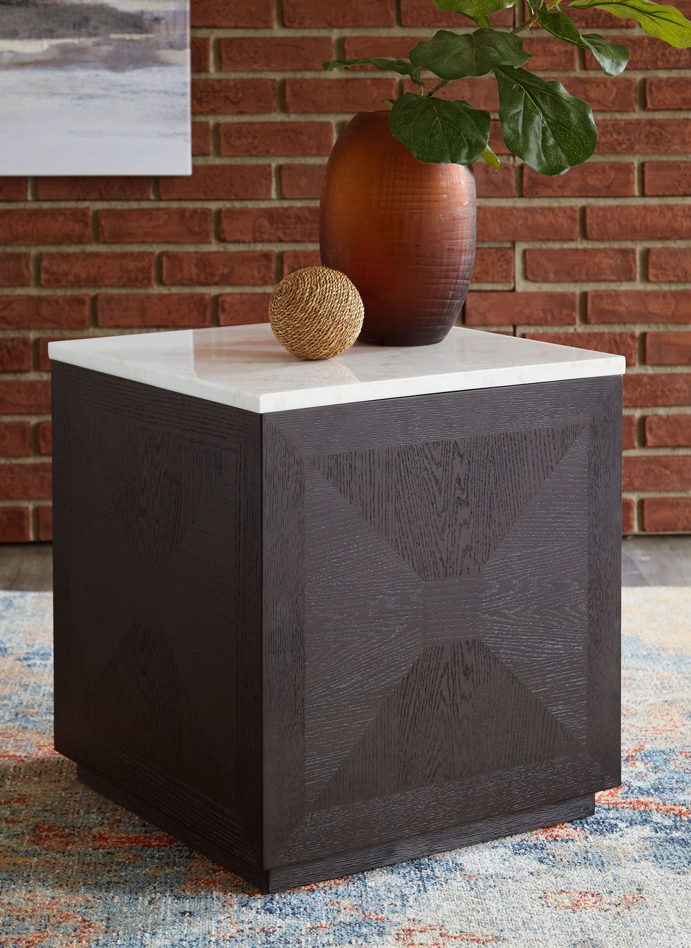 With its sleek, square base, this accent table is a versatile performer. Use individually or pair two or three together to create a coffee table effect. Elegant inlaid details and a white marble top elevate the design.<br/><br/><b>Product Features</b><ul>