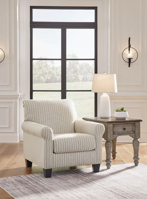  transitional style? Enter this accent chair. Its commitment to carefree comfort is right at home with your relaxed living room aesthetic. A classic striped pattern elevates the everyday charm of the neutral fabric