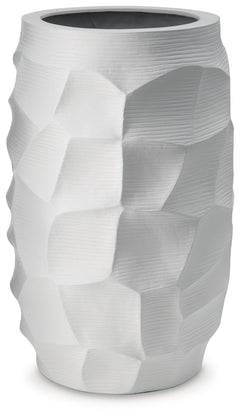 A contemporary take on texture. This vaseâ€™s sculptural details are made all the more beautiful with a crisp white finish. Itâ€™s stunning when displayed on its own, making an impression on accent tables and bookshelves. Want to change your decor with th