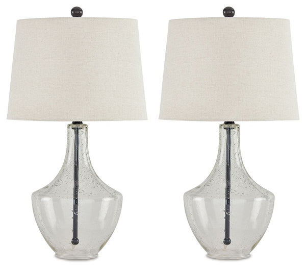 Simple yet elegant, this table lamp sets the scene for high style. Crafted of metal in a fashionable finish, this pair of lamps feature a straight post body enhanced in curvaceous seeded glass. Up top, a modified drum shade with beige fabric adds textural