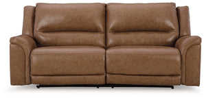 This power reclining sofa delivers comfort and contemporary style in a big (but not bulky) way. Its supple leather and faux leather upholstery, sumptuous cushioning and one-touch control are sure to take you to your happy place. The sofa-'s power adjustab