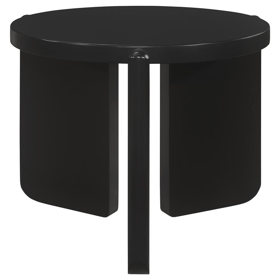 Nestled quietly by your sofa, this end table exudes a contemporary calm, its round shape a soft counterpoint to the angular lines of modern interiors. Solid wood bends and curves in a display of craftsmanship, presenting a substantial yet refined presence